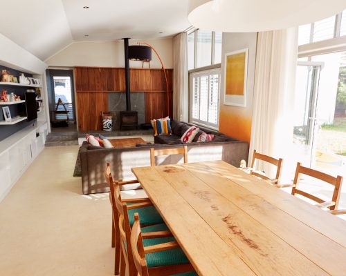 Dining Table With Chairs And Seating Area In Stylish And Contemporary Open Plan Empty Home